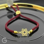 دستبند مارشال زرشکی با پلاک طلای گل