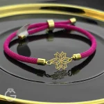 دستبند مارشال صورتی با پلاک طلای گل