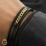 دستبند چرم بافت با کارتیه طلا