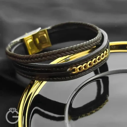 دستبند چرم بافت با کارتیه طلا