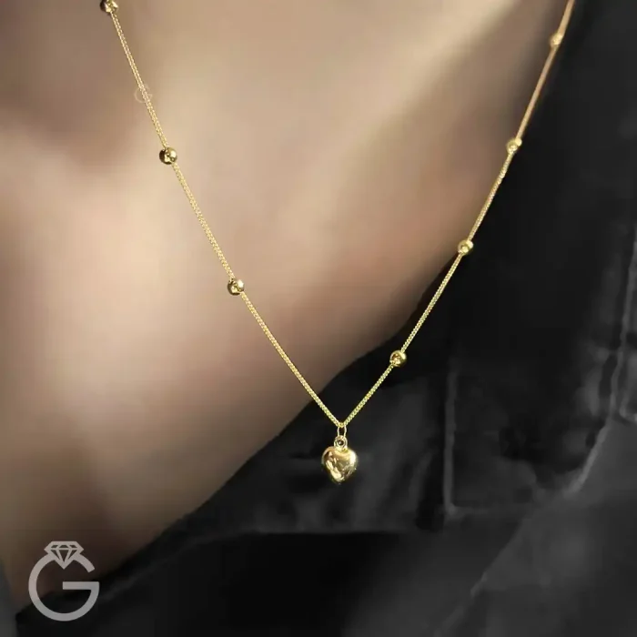 گردنبند طلای قلب و گوی دو