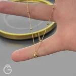 گردنبند طلای قلب و گوی دو