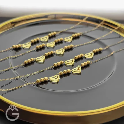 دستبند طلای قلب و گوی