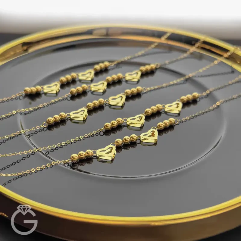 دستبند طلای قلب و گوی